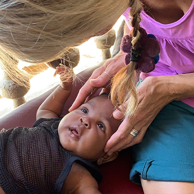 Maryellen carrying out treatment on baby
