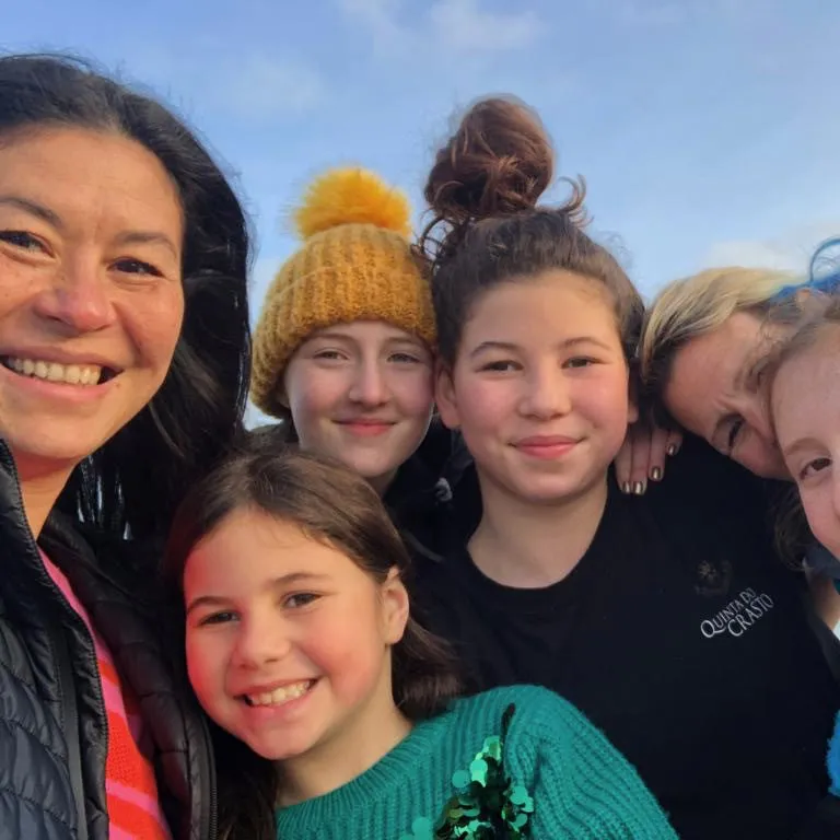 Family photo, two women and 4 children