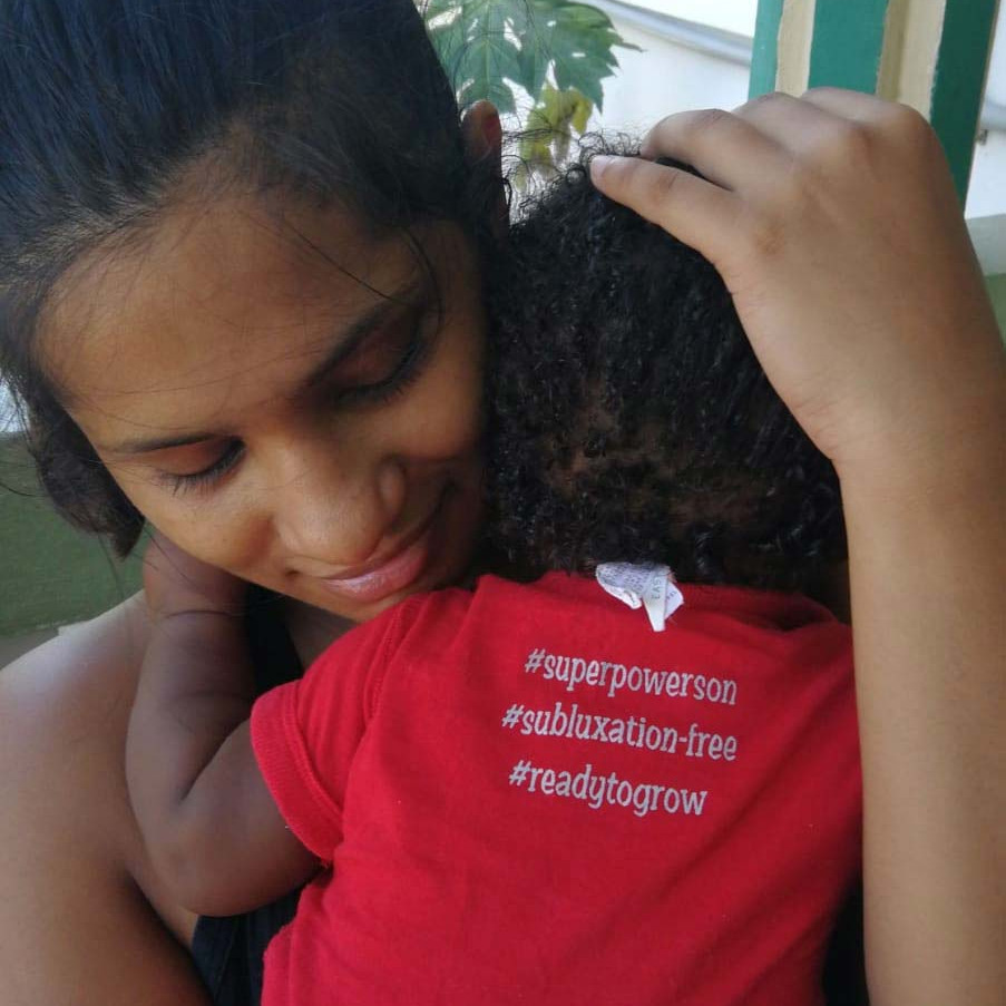Woman cuddling new baby